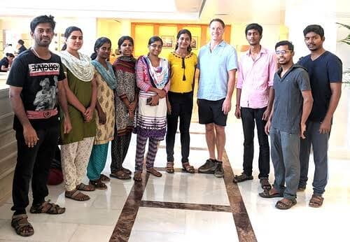 The CubeYogi delivery team standing together with the CW Products project lead in a hotel lobby